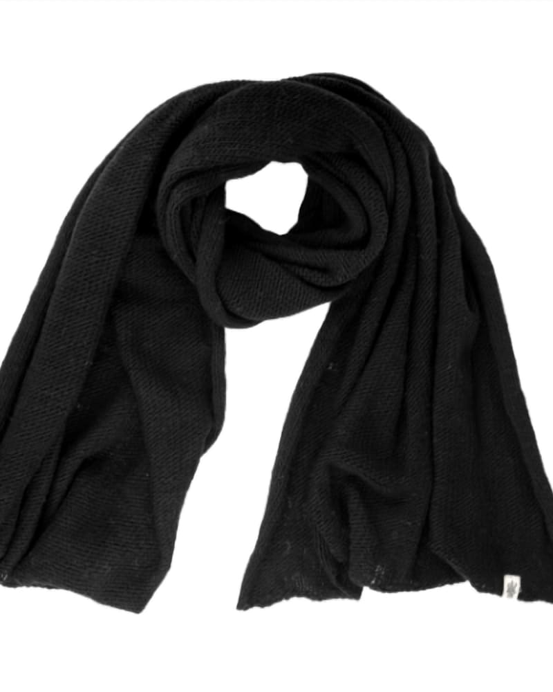 Front of a model wearing a size one-size-fits-all Air Wrap Scarf In Black in Black by Nirvanna Designs. | dia_product_style_image_id:351686